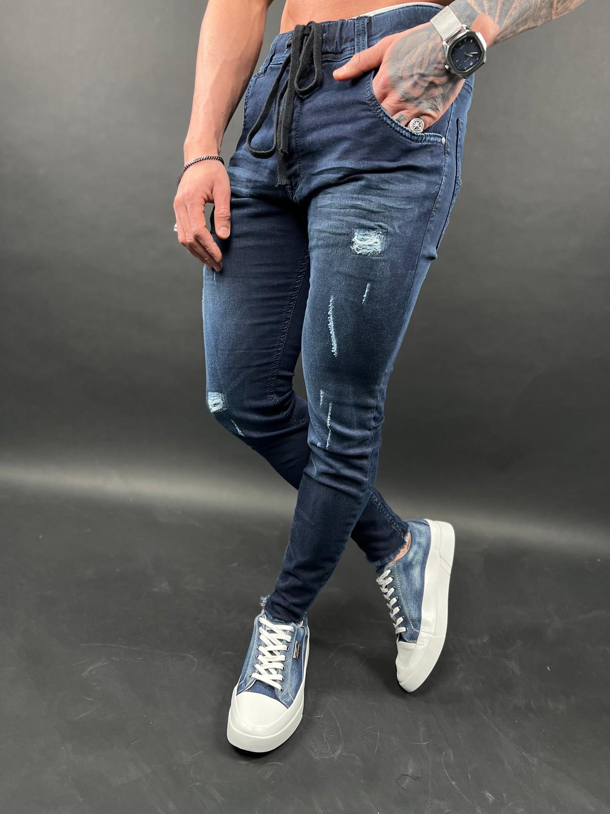 ג'ינס ג'וגר ג'וגר מתיחה בצבע כחול כהה עם קרעים עדינים