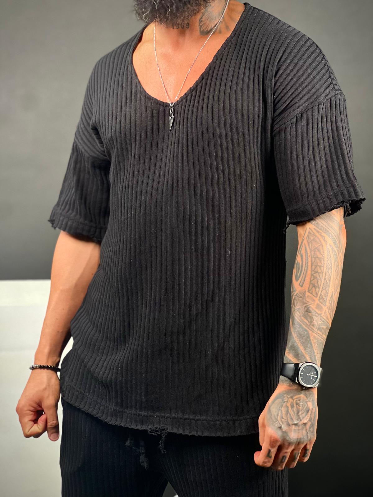 Oversized short-sleeve shirt with a rounded neckline made from striped linen fabric.