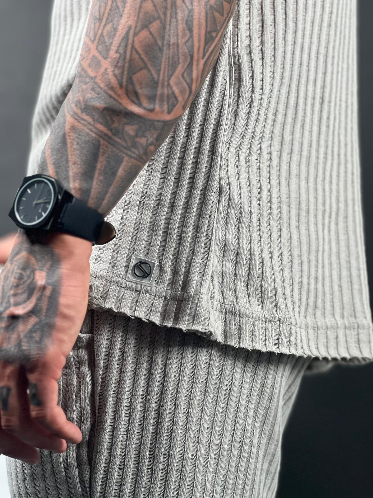 Oversized short-sleeve shirt with a rounded neckline made from striped linen fabric.