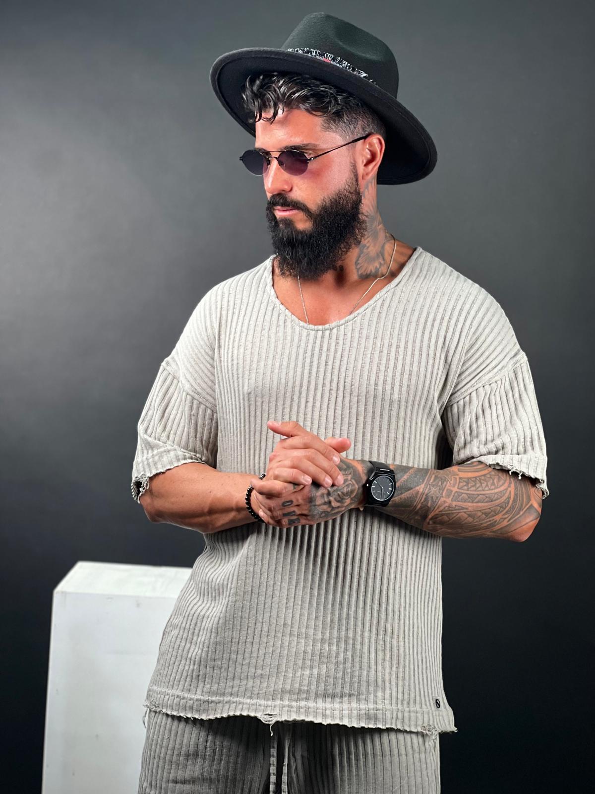 Oversized short-sleeve shirt with a rounded neckline made from striped linen fabric.