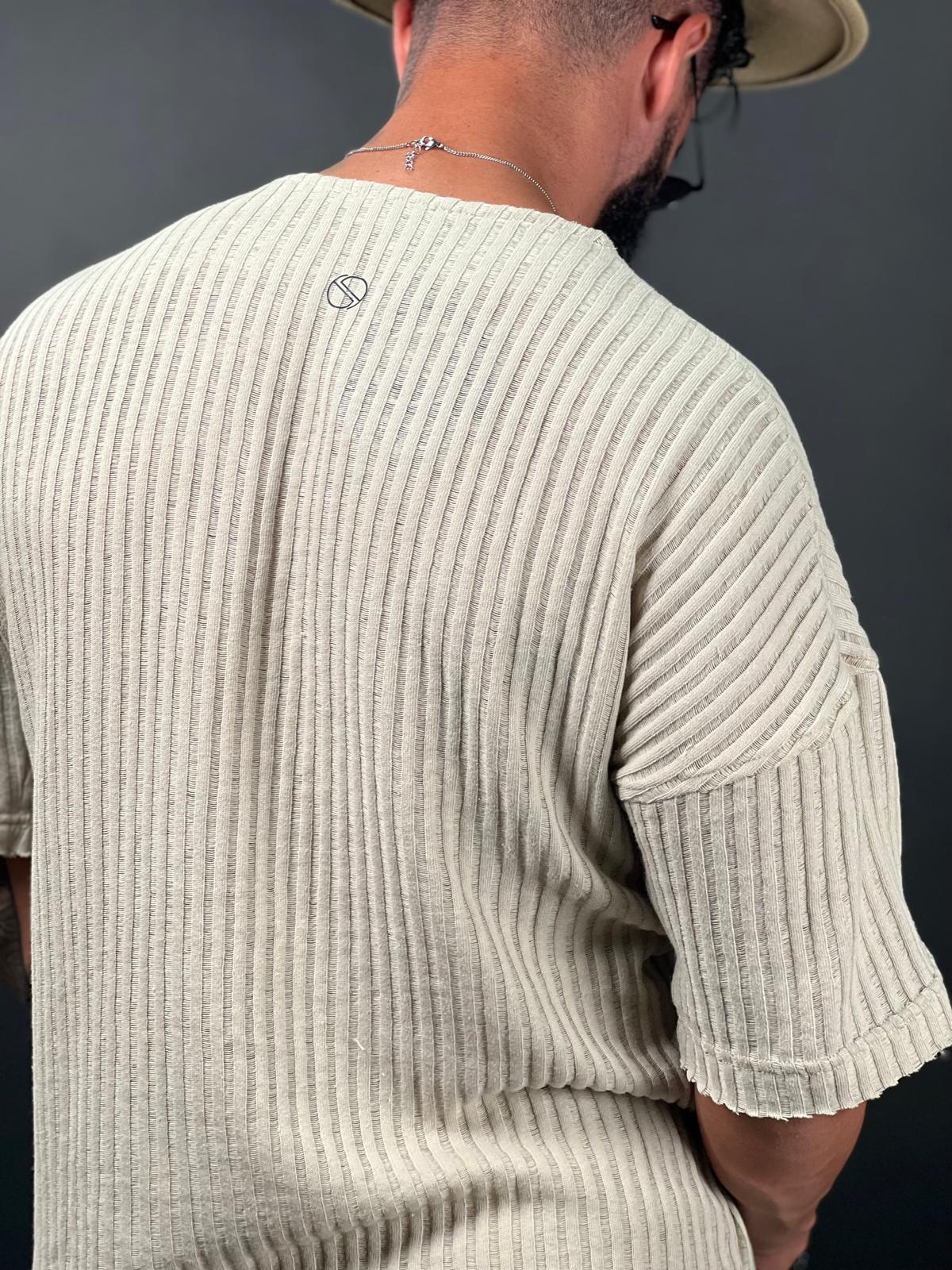 Oversized short-sleeve shirt with a rounded neckline made from striped linen fabric.