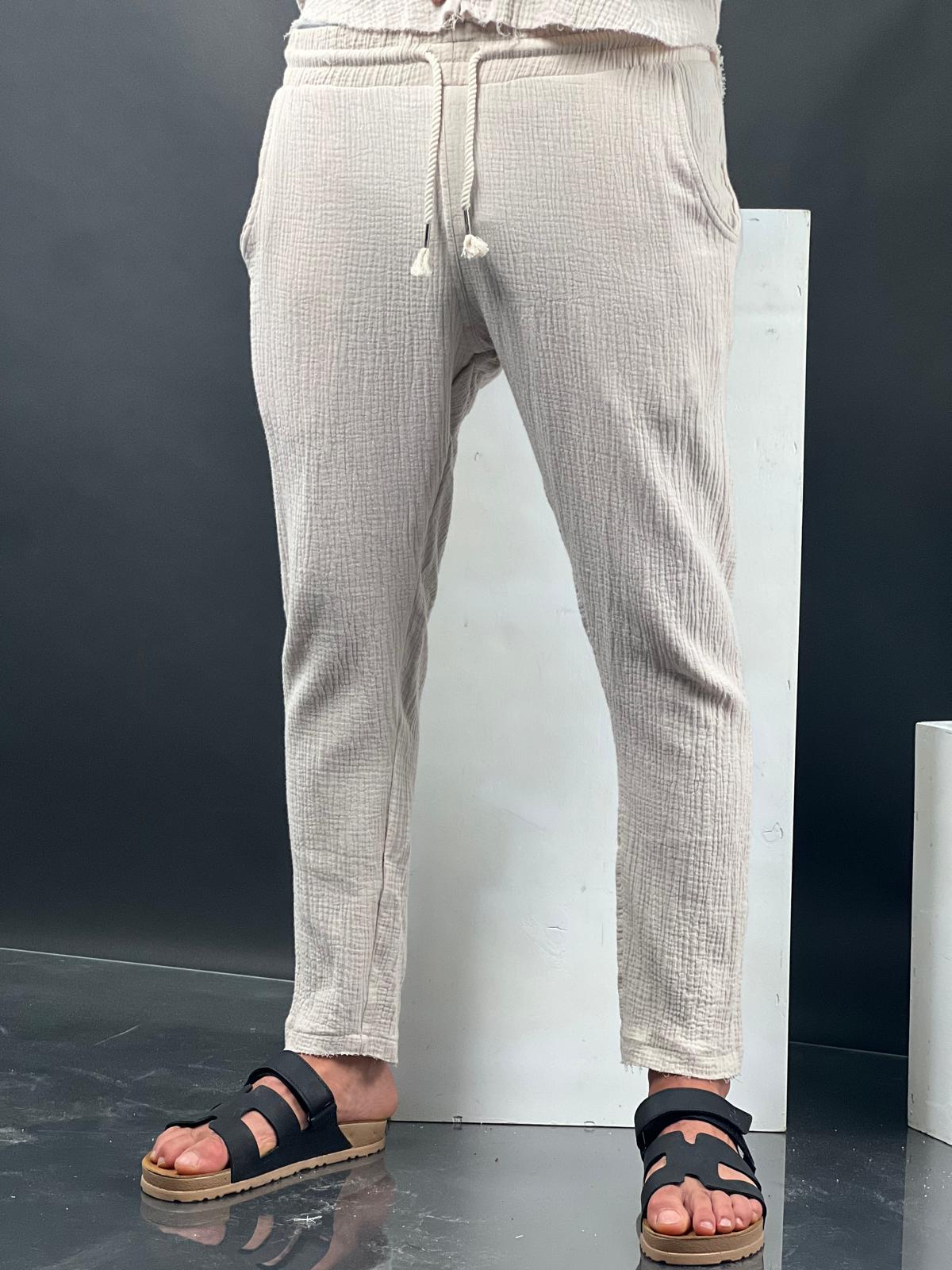 Long linen pants made from soft fabric with delicate distressed finishing.-Soliton collection