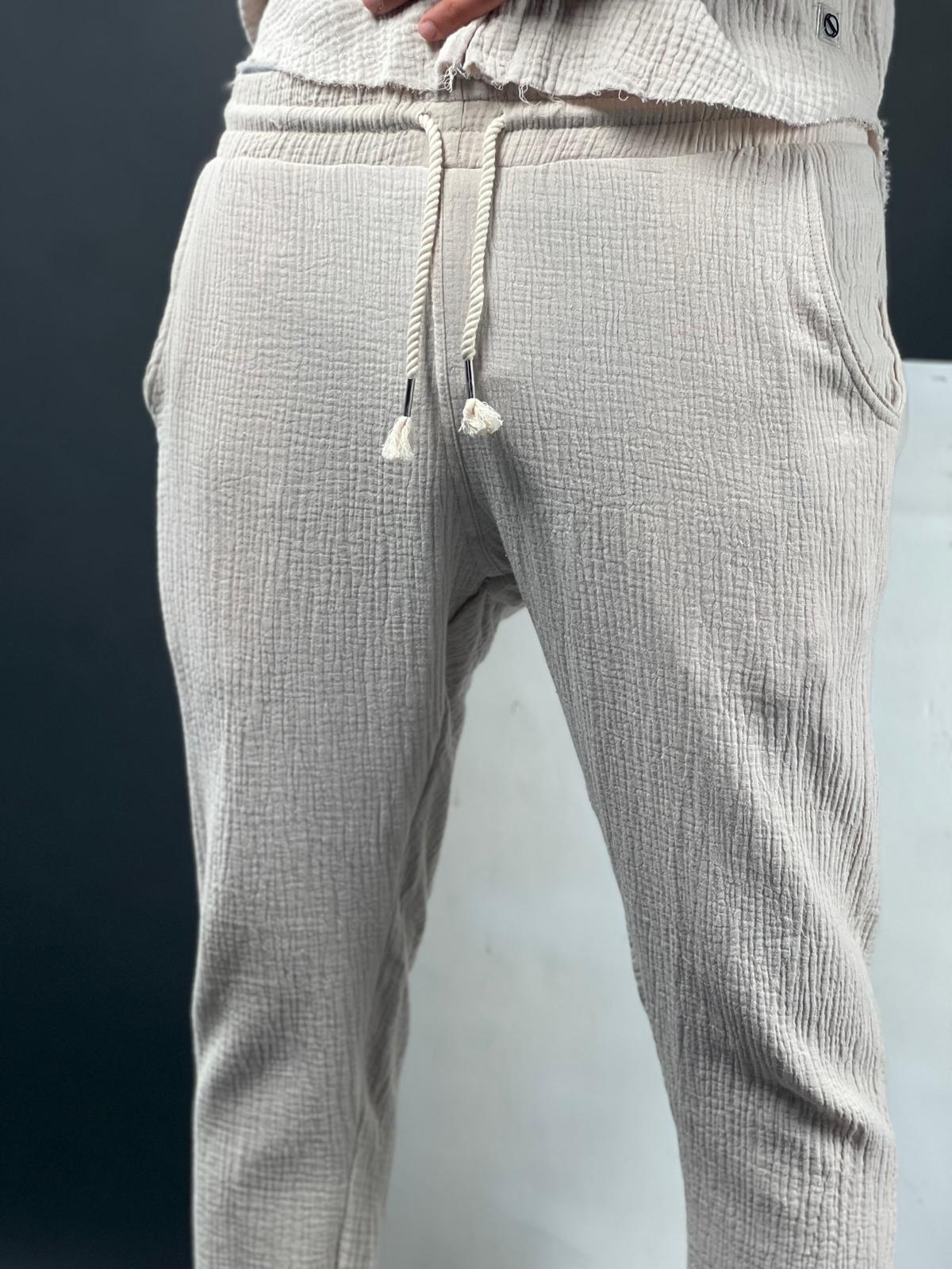 Long linen pants made from soft fabric with delicate distressed finishing.-Soliton collection