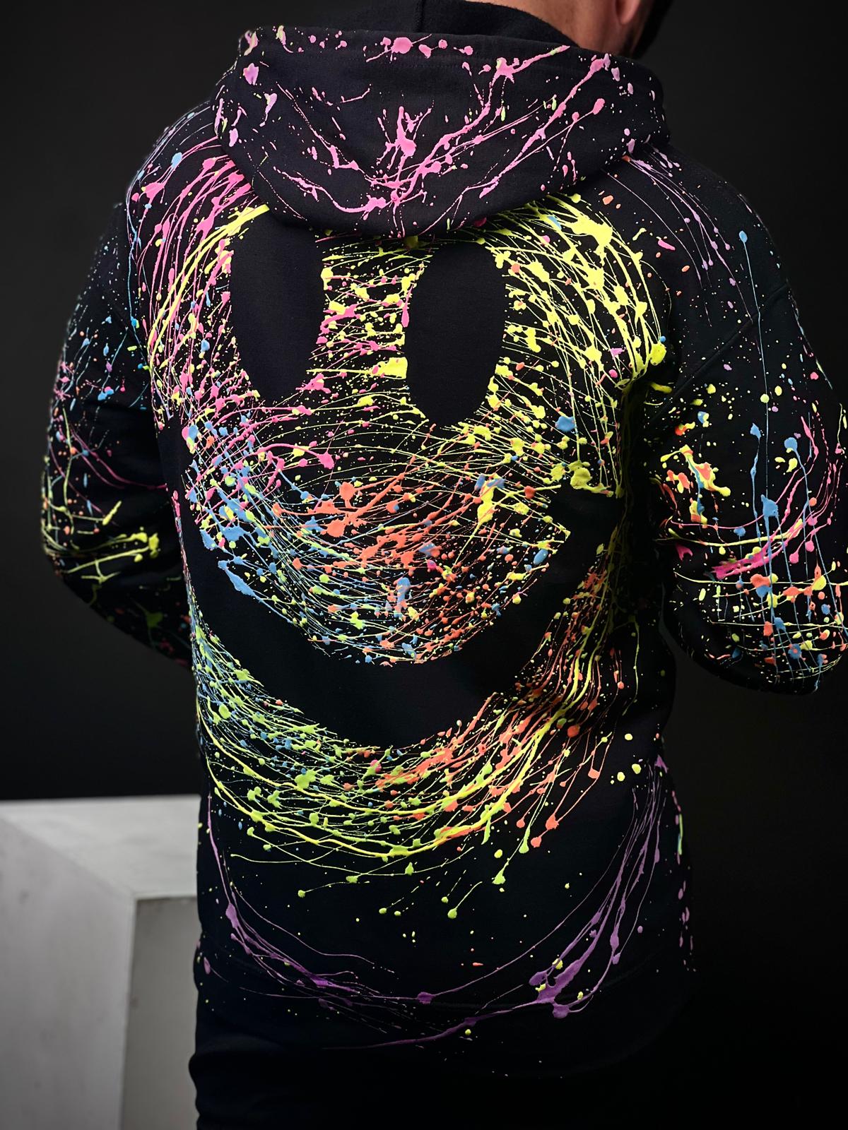 Unisex Handmade Hoodie with Glow-in-the-Dark Paint Splatter – Featuring a Large Smiley Design – Part of the Exclusive Halloween Collection