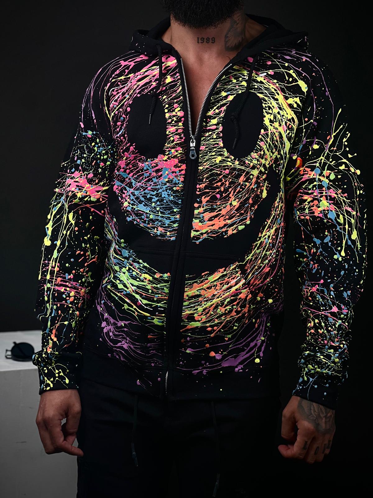 Unisex Handmade Hoodie with Glow-in-the-Dark Paint Splatter – Featuring a Large Smiley Design – Part of the Exclusive Halloween Collection